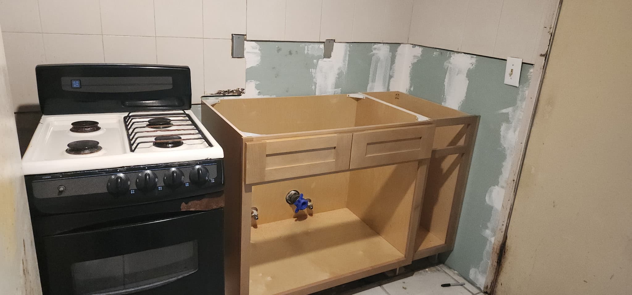New cabinet installation & plumbing rough-in